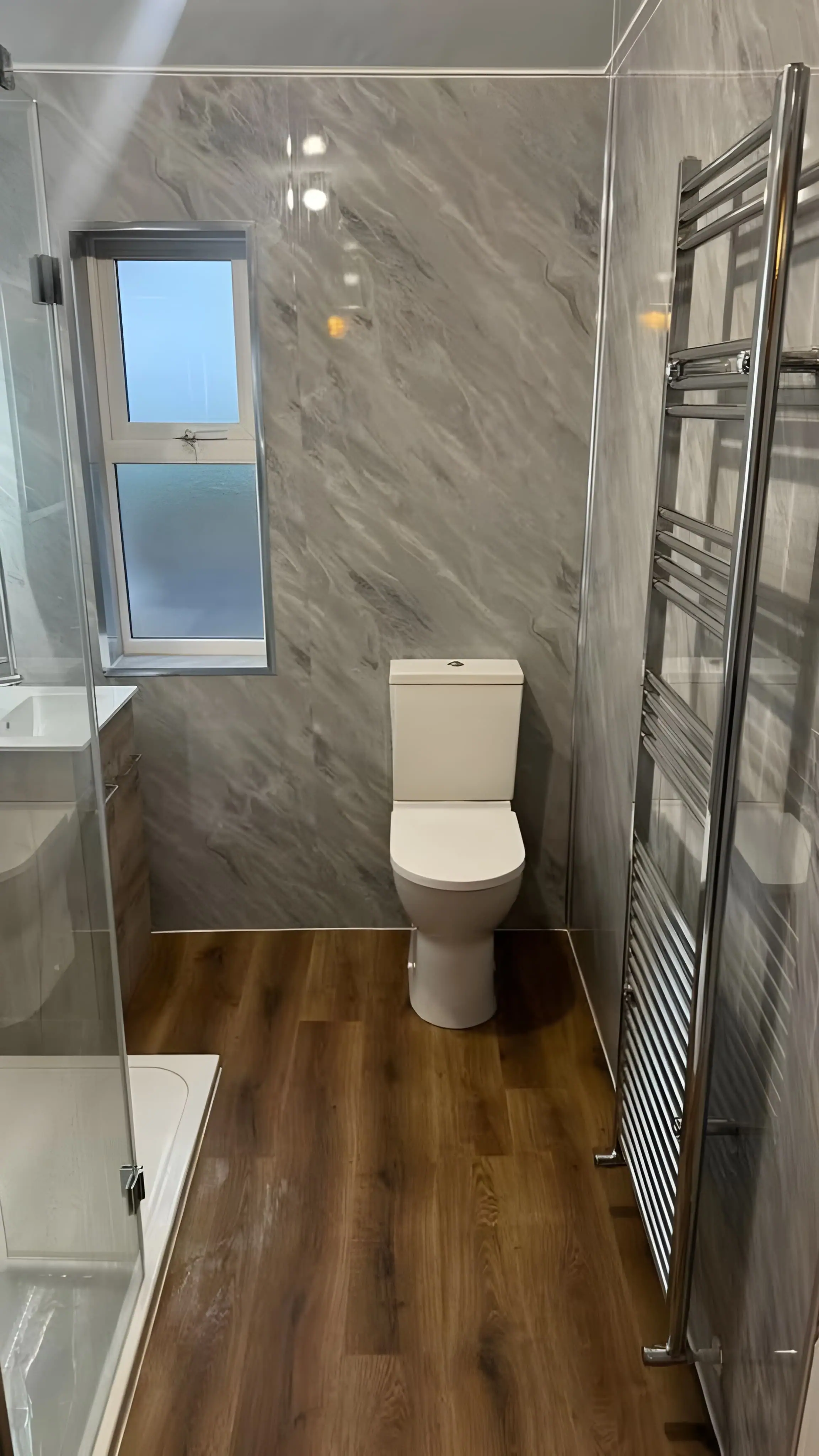 Fully renovated bathroom with EcoPanel waterproof PVC panels installed